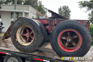 Tandem trailer dolly  hauled on a flatbed trailer.